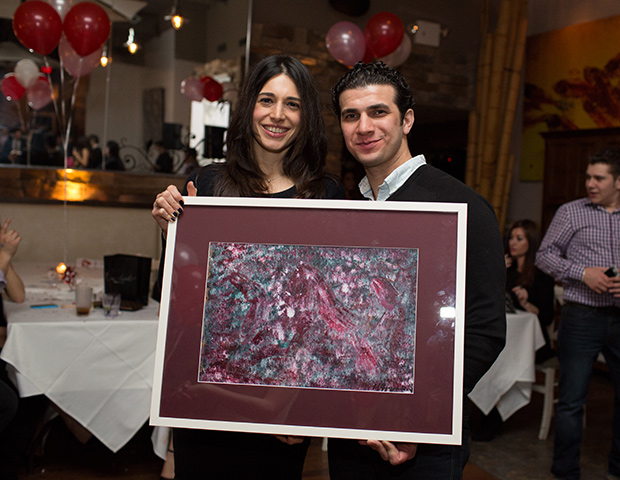 Othonas Arygrou wins Maria Fragoudaki painting (posing with Maria Fragoudaki), PHOTO: VINCENT TULLO