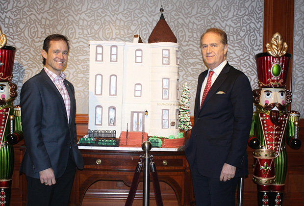 Mike and Andy Manatos with Ritz Carlton's four-foot high gingerbread replica of the office building of their Washington public policy company (bottom)