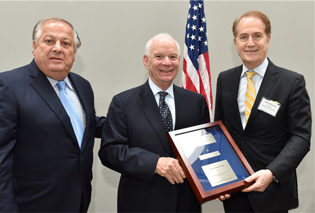 Senator Ben Cardin receives the Paraskevaides Award from Philip Christopher and Andy Manatos