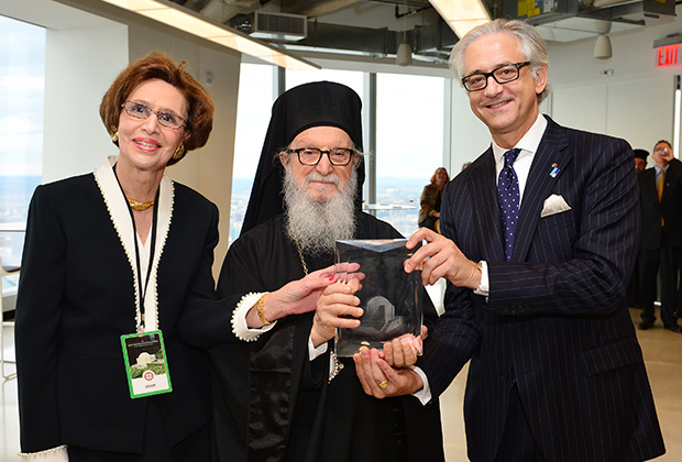 George S. Tsandikos and Paulette Poulos accept award of St. Nicholas Greek Orthodox National Shrine from His Eminence Archbishop Demetrios in acknowledgement of Leadership 100 support in October of 2014.