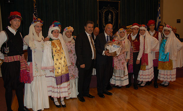 Michael Psaros and John Kontolios with members of the Chian Federation dancing troupe