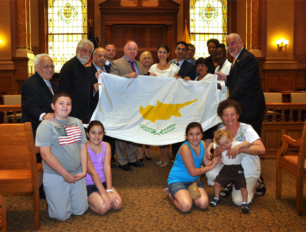 Bill Matsikoudis with then Consul General of Cyprus Koula Sophianou, members of City Council and community members raised the Cyprus flag in City Hall