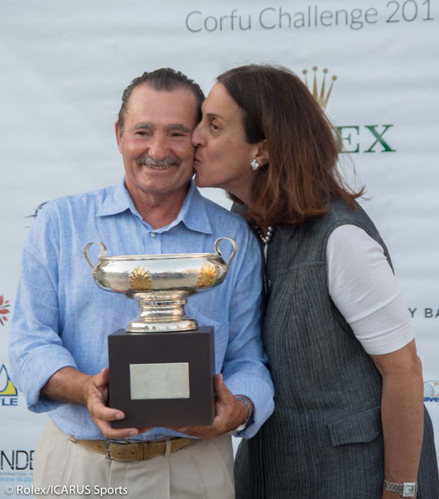George Sakellaris with trophy is congratulated by his wife, Cathy.
