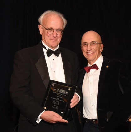 AHC Chairman Menas Kafatos awards the Theodore Saloutos Award to Prof. John Camp