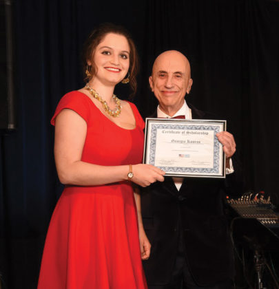 AHC Chairman Menas Kafatos awards the Dr. and Mrs. James Kallins Scholarship to Georgia Kouros