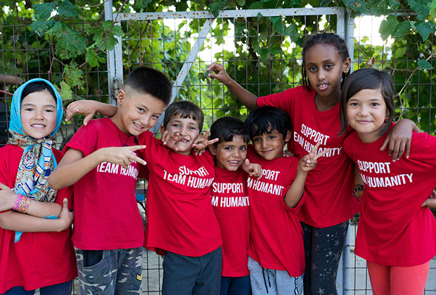 Children from the Hope and Peace Center in Lesvos.  The Hope and Peace center is run by Team Humanity. It is situated across the street from the Moria refugee camp on Lesvos, and acts as a safe space for women to rest and children to play. Team Humanity is the current recipient of When We Band Together proceeds.