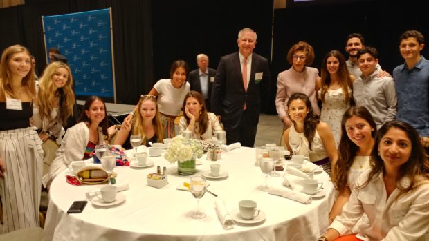 Guest speaker Stellene Volandes, Editor in Chief of Town and Country magazine, with L100 Chairman Argyris Vassiliou, Executive Director Paulette Poulos, and members of the youth at the recent L100 conference. PHOTO: ETA PRESS