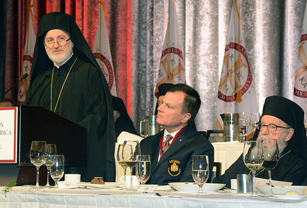 Archbishop Elpidophoros addressing the luncheon. On his left are Mike Emanuel who presented the program, and Archbishop Demetrios, former of America.