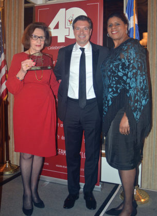 Paulette Poulos having received the award from Spiros Maliagros and Ruth C. Browne, PHOTO: ETA PRESS