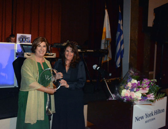 Author and activist Tasoula Hatzitofi receives the WIN award (in a Tiffany crystal) from President Theana Iordanou. PHOTO: ETA PRESS