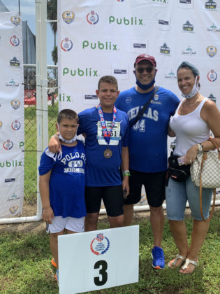 Brothers Argyrios and Georgios Stergiopoulos with their parents Drs. Sotirios and Matina Stergiopoulos at AAU Junior Olympic Games in Florida