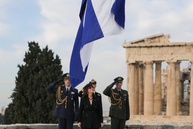  The flag being raised at the Acropolis with President Katerina Sakellaropoulou