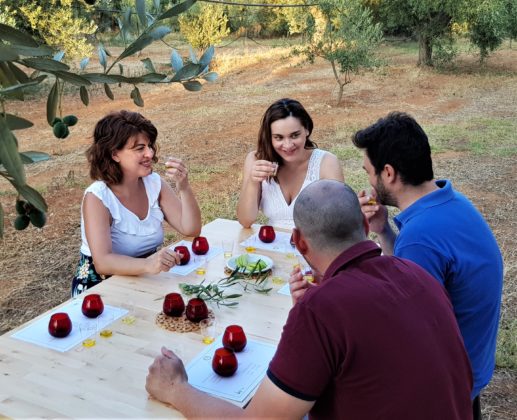 Visitors enjoy an olive oil tasting with Marianna Devetzoglou of Oleosophia (2nd from left). COURTESY OLEOSOPHIA