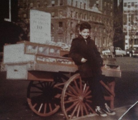 Elias as a young boy was at work with his father, out of a pushcart in Lower Manhattan, near the Customs House