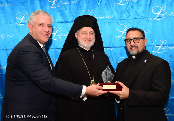Chairman Argyris Vassiliou and His Eminence Archbishop Elpidophoros of America present the Leadership 100 Achievement Award to Rev. Fr. Gary Kyriacou, Director of Ionian Village of the Greek Orthodox Archdiocese of America