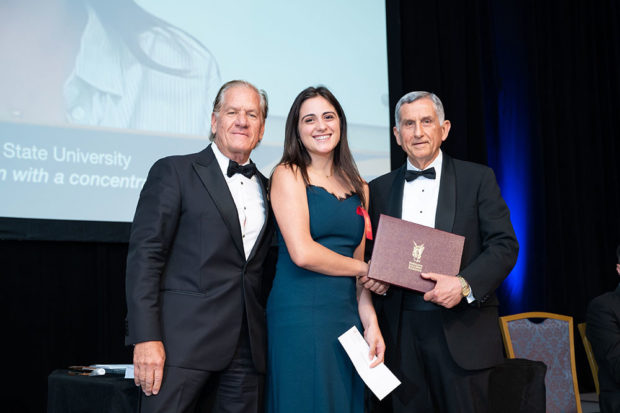 Alexia Armatas, (center), a rising senior at Colorado State University, is presented a PanHellenic Scholarship Award by Chairman Robert Buhler, (left), and Academic Committee Chair Tassos Malliaris, PhD