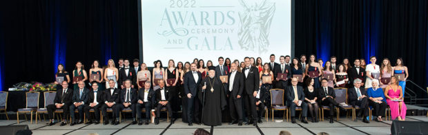 His Grace Bishop Timothy of Hexamilion, Chancellor of the Greek Orthodox Metropolis of Chicago, (center), flanked by 2022 Paradigm Award Honoree Dr. George Yancopoulos (left) and 2021 Paradigm Award Honoree George Pelecanos (right) along with Chairman Robert Buhler (seated to left of Yancopoulos), Trustees John Manos (seated next to Buhler) and Tom Sotos (standing to the right of Pelecanos), plus several donors, Academic Committee Members, and Advisory Board Members congratulate the 2022 PanHellenic Scholarship Foundation recipient