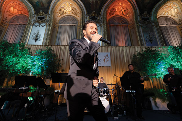 Greek singer Thanos Petrelis performs at the NHM Gala. Photo by Gold Grid Studios