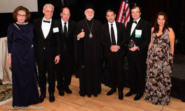 Presentation of Archbishop Iakovos Leadership 100 Award for Excellence, L to R, Paulette Poulos, Dr. Costis Maglaras, Carl Hollister, Archbishop Elpidophoros, Panos Panay, Demetrios G. Logothetis, and Yvette Manessis Corporon, at 32nd Annual Leadership 100 Conference