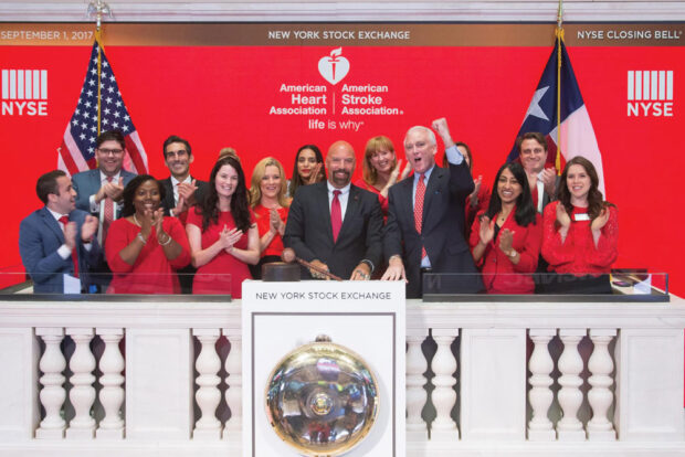 Michael ringing the opening bell at the NYSE on behalf of the American Heart Association