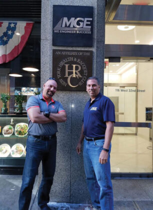 Michael and Peter standing in front of the MG Engineering headquarters on 32nd Street
