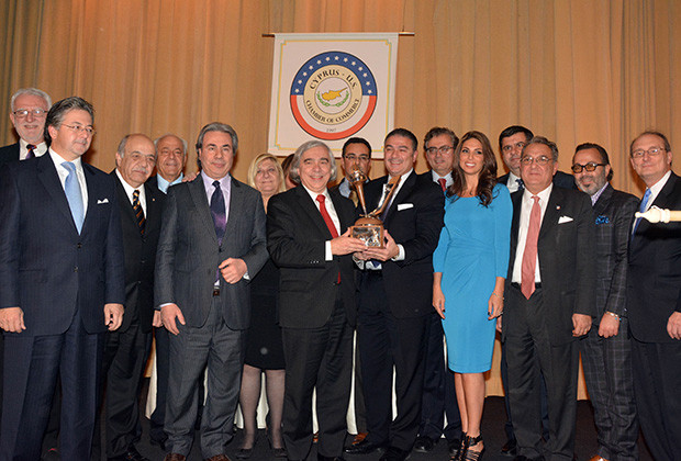Secretary of Energy, Dr Ernest Moniz is receiving the Cyprus-US Distinguished Merit Award. From left, Theo David, Vassos Vassiliou, Andy Comodromos, Renos Georgiou, Nikos Mouyiaris, Despina Axiotakis. The Honoree, Dr. Ernest J. Moniz, Michael Hadjiloucas, Nicholas Karacostas, Nicolas Nicolaou, Nicole Pettalides Tsiolas, Chris Nicolaou, Dennis Droushiotis, Christos Theoharis, Peter Kakoyiannis