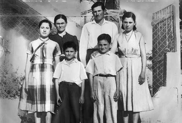 Photo of George with his siblings and parents in Vassara Greece (1956) before they immigrated to the United States. Back row from left, Helen, Areti, Panos and Pota Sakellaris. Front, Arthur and George Sakellaris