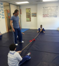 Konstantinos Doikos, who holds a Pankration Instructor certificate from the General Secretariat of Sports in Greece and is a gold medalist athlete in Pankration Athlema, supervising the “dielkistinda" (tug of war) game