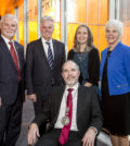 John P. Calamos, Sr., (left), University President Alan W. Cramb, and Lewis College of Human Sciences Dean Christine Hines (far right) pose with John & Mae Calamos Endowed Chair of Philosophy JD Trout, Ph.D., (seated) and his wife Janice Nadler (standing center)
