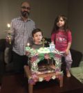 The Dagiantis Family of Naperville, IL built their own Epitaphios, designed by 8 year-old Panayiotis (center). The family processed with it outside on Holy Friday night. PHOTO COURTESY DAGIANTIS FAMILY