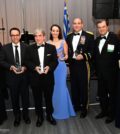 Archbishop Elpidophoros of America, (Left) and Demetrios G. Logothetis and Paulette Poulos (Far Right) present the Archbishop Iakovos Leadership 100 Award for Excellence to (L to R) to Dr. Theodoros Teknos, Dr. Leonidas Platanias, Matina Kolokotronis, and General Andrew P. Poppas, at Leadership 100 Grand Banquet; PHOTO: DIMITRIOS PANAGOS